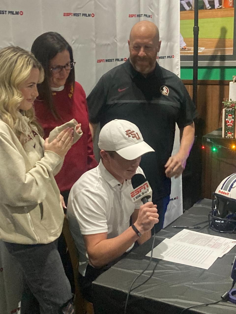American Heritage-Delray kicker Jake Weinberg signs to continue his football career with Florida State in a ceremony on Dec. 20, 2023 in Delray Beach.