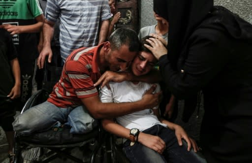 Relatives mourn 17-year-old Ali al-Ashqar, one of two Palestinian teenagers killed by Israeli fire during clashes at the border on Friday