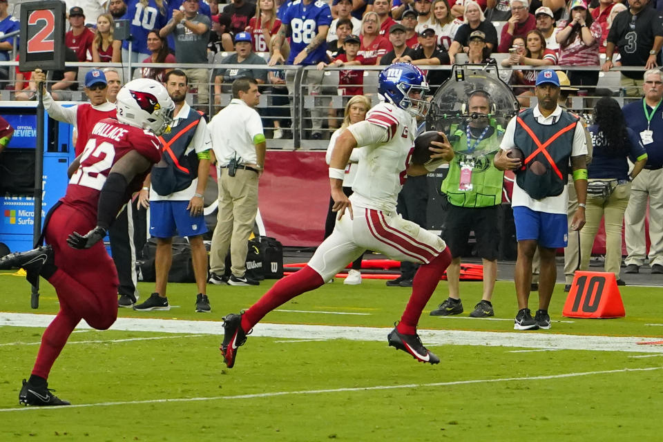 New York Giants quarterback Daniel Jones (8) runs in for a touchdown against the Arizona Cardinals during the second half of an NFL football game, Sunday, Sept. 17, 2023, in Glendale, Ariz. (AP Photo/Matt York)