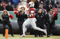 Louisville's Jawhar Jordan runs for a touchdown during the second quarter of the Fenway Bowl NCAA college football game against Cincinnati at Fenway Park Saturday, Dec. 17, 2022, in Boston. (AP Photo/Winslow Townson)
