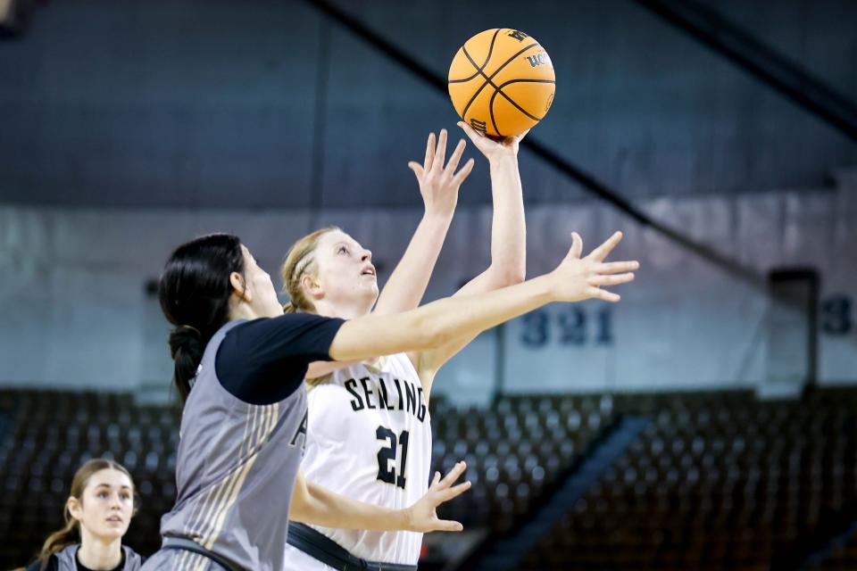 Seiling’s Keirstin Briggs (21) lays up the ball during a Class A state quarterfinal girls high school basketball game between Seiling and Allen at Jim Norick Arena in Oklahoma City on Thursday, Feb. 29, 2024.