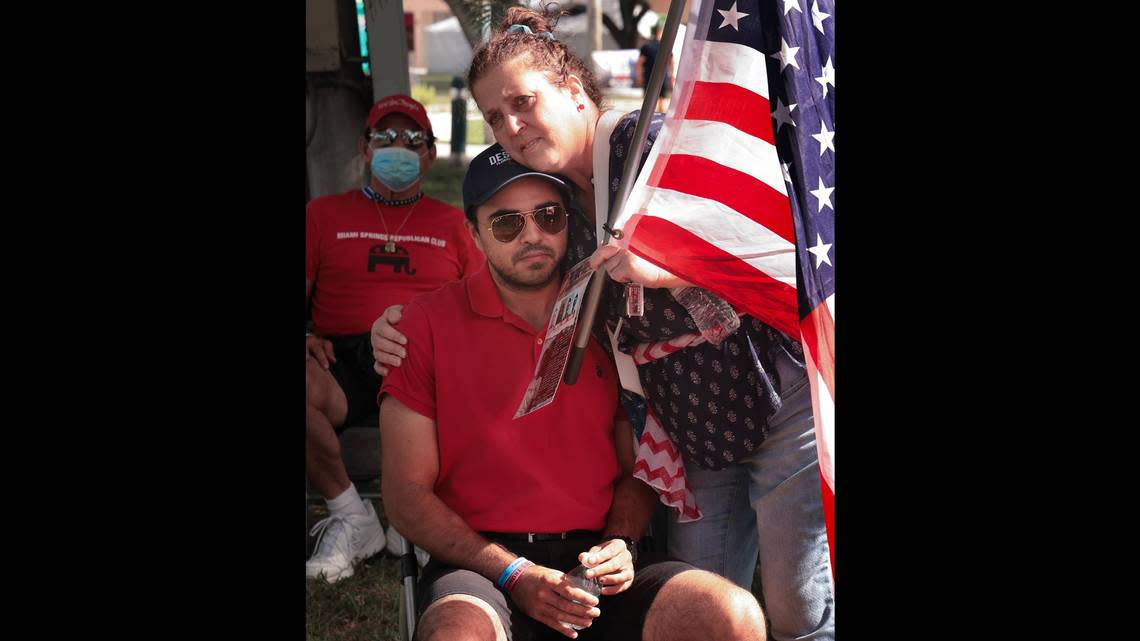 Christopher Monzon receives a hug at an Oct. 30, 2022, rally in Miami Springs, Florida, where he is vice president of the local Republican organization.
