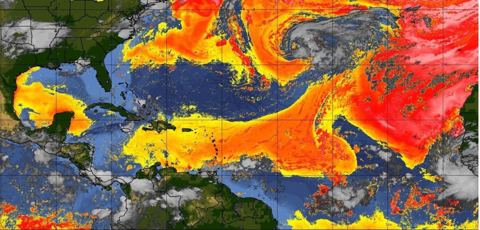 The yellow to red colors denote the Saharan air layer over the Atlantic Ocean on July 14, 2023. The deeper orange and red coloring denotes a higher amount of dust.