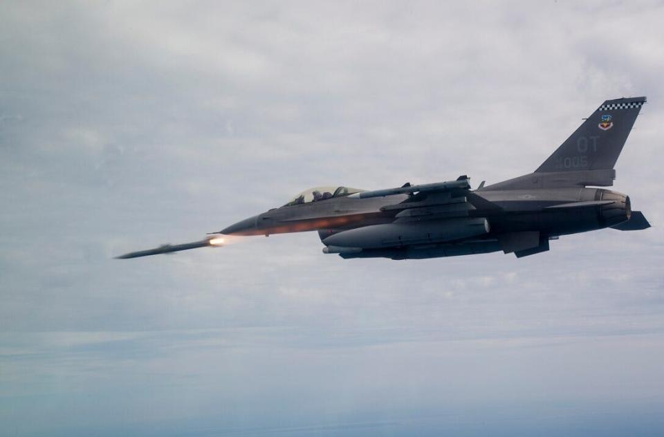 A US Air Force F-16 firing an AIM-120 AMRAAM over the gulf near Eglin AFB