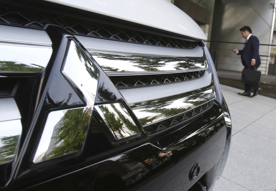 FILE - In this Monday, Nov. 26, 2018, file photo, the logo of Mitsubishi Motors is seen at the automaker's headquarters in Tokyo. German-U.S. automaker Daimler Chrysler bought a 37 percent stake in Tokyo-based Mitsubishi Motors Corp. in 2000, but the alliance felt rocky from the start. Mitsubishi Motors was embroiled in a years-long scandal over its systematic cover-up of auto defects. (AP Photo/Koji Sasahara, File)