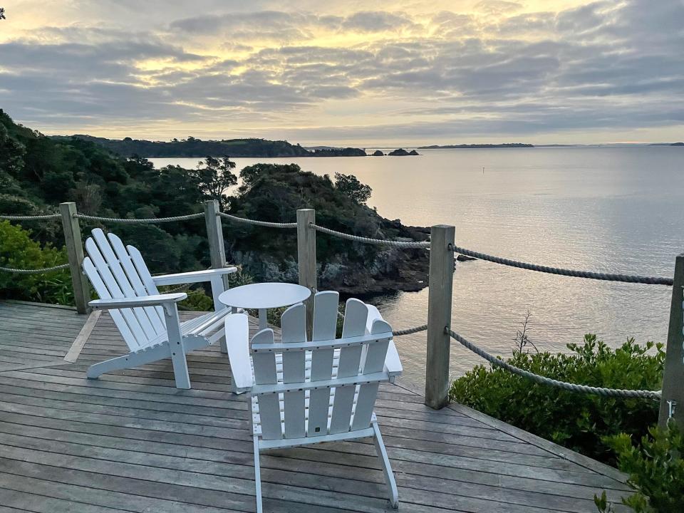 The outdoor deck had a table and two reclining chairs.