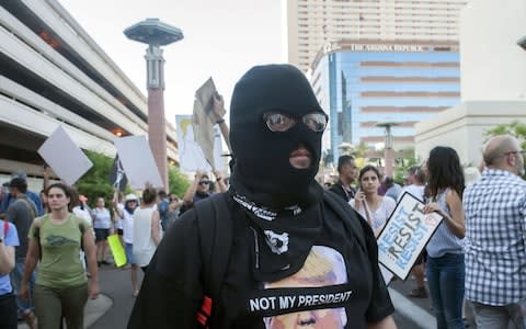 Demonstrators gather outside the Phoenix, Arizona, Convention Center - Credit: AFP