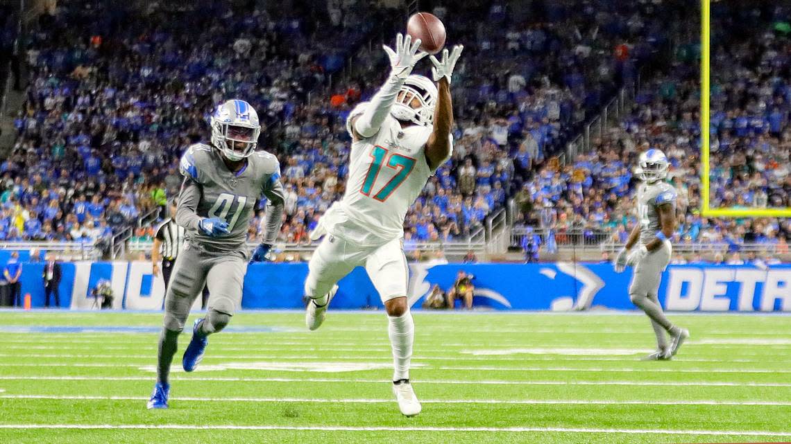 Miami Dolphins wide receiver Jaylen Waddle (17) catches a touchdown pass as Detroit Lions cornerback AJ Parker (41) defends in the second quarter at Ford Field in Detroit, Michigan on Sunday, October 30, 2022.