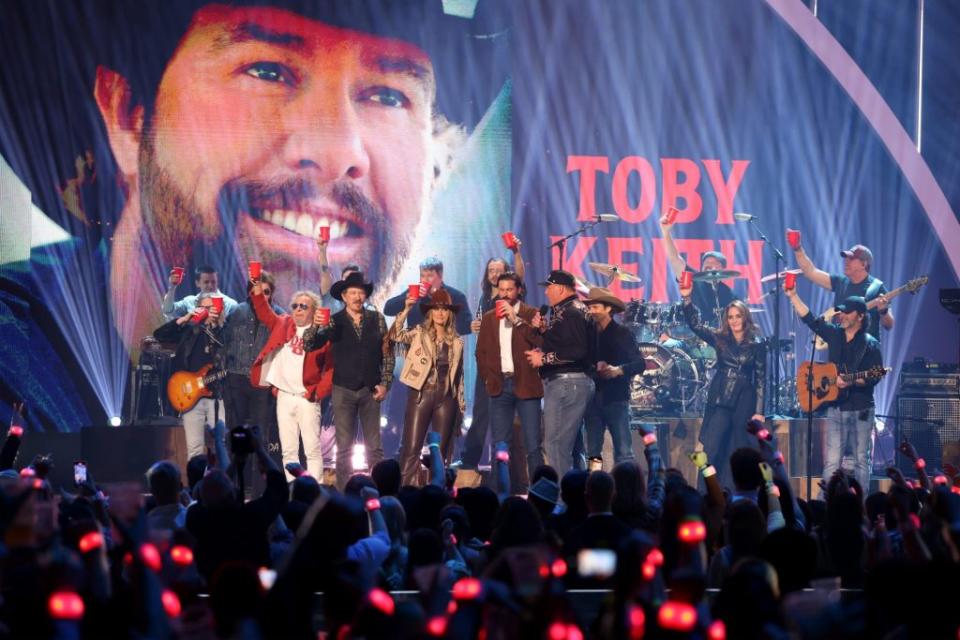 During the awards show, everyone held up a cup in loving memory of the late singer. Getty Images for CMT