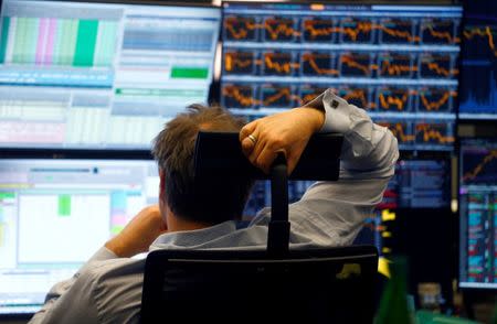 FILE PHOTO: A trader works at Frankfurt's stock exchange in Frankfurt, Germany, April 6, 2018. REUTERS/Ralph Orlowski/File Photo - RC1155758F80