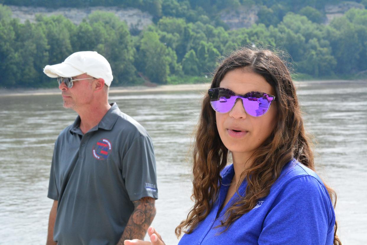 Nicole Samer, MoDOT project engineer, right, and Anthony Moore, Lunda Construction project engineer, provide updates Saturday on construction of the Lance Cpl. Leon Deraps Interstate 70 Missouri River Bridge at Rocheport. The public meeting was held from Taylor's Landing Access with a view of the bridge.