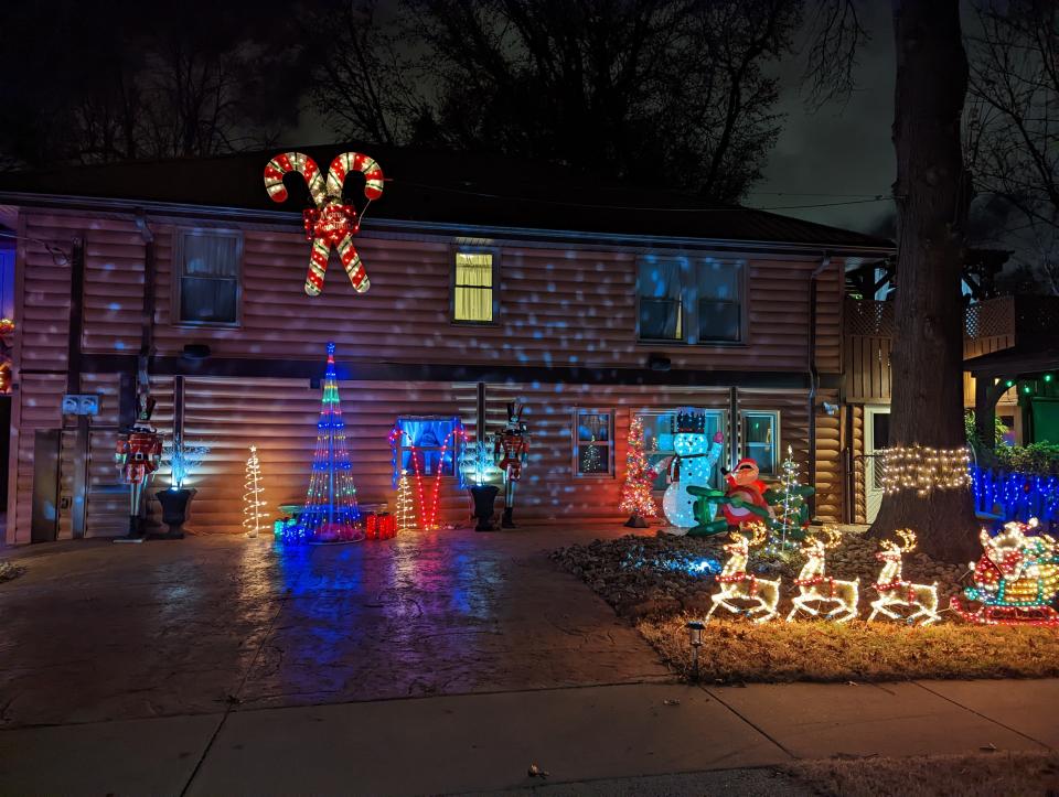 Michael and Gissell Sommer are excited to welcome folks to enjoy their Christmas display this year at 1970 S. Kings Ave. The yard features an array of pixel lights, a nativity scene, Santa Claus peering from inside a window and video projections. Michael said Santa Claus or Grinch may occasionally be around to take photos with visitors.