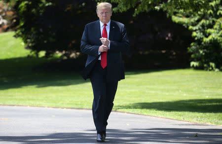 U.S. President Donald Trump leaves the Oval Office to speak to the news media before boarding Marine One to depart for travel to Japan from the South Lawn of the White House in Washington, U.S., May 24, 2019. REUTERS/Leah Millis