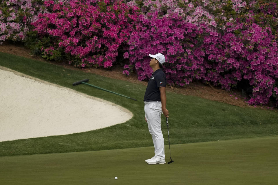 CORRECTS SPELLING OF NAME TO SI, NOT IS - Si Woo Kim, of South Korea, reacts after missing an eagle putt on the 13th green during the second round of the Masters golf tournament on Friday, April 9, 2021, in Augusta, Ga. (AP Photo/David J. Phillip)