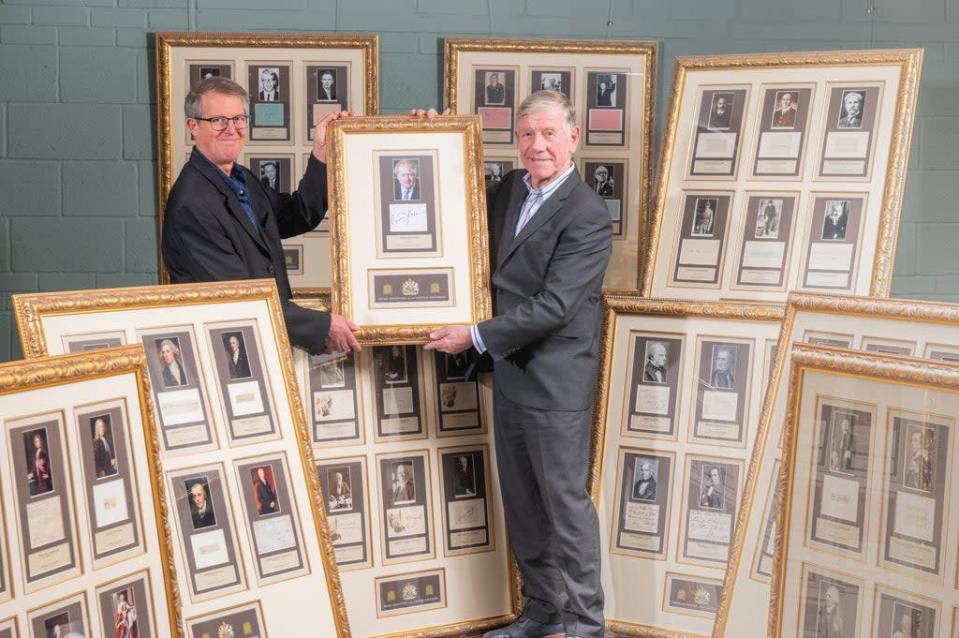 Chris Albury (left) and Hamilton Bland with the framed collection. Credit: Jamie Gray Photography