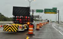 Access roads to the Sunshine Skyway bridge are blocked off as the span is closed due to high winds from Hurricane Ian on Wednesday, Sept. 28, 2022 in St. Petersburg, Fla. Hurricane Ian has made landfall in southwestern Florida as a massive Category 4 storm.(Dirk Shadd/Tampa Bay Times via AP)