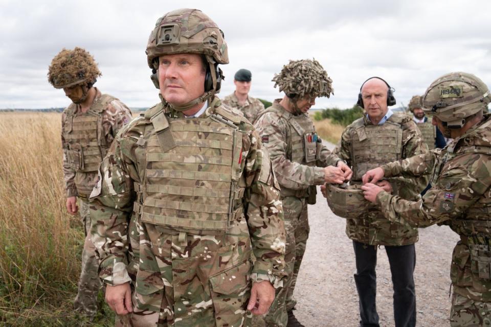 Labour leader Sir Keir Starmer and shadow defence secretary, John Healey (centre right) meets British soldiers at Salisbury Plain (Stefan Rousseau/PA) (PA Wire)