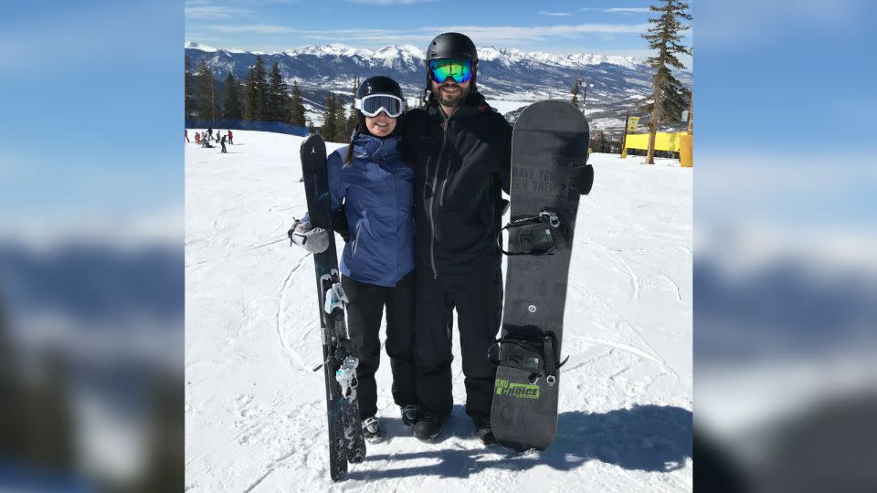Alexandra and Shawn smile for a photo at a ski resort in March 2018. - Alexandra Wyman