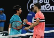 Tennis - Australian Open - Rod Laver Arena, Melbourne, Australia, January 17, 2018. Bulgaria's Grigor Dimitrov shakes hands with Mackenzie McDonald of the U.S. after Dimitrov won their match. REUTERS/Issei Kato