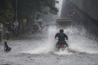 MUMBAI, INDIA - JULY 15: Vehicles drive through waterlogged road due to heavy rain at Gandhi Market, Sion, on July 15, 2020 in Mumbai, India. (Photo by Pratik Chorge/Hindustan Times via Getty Images)