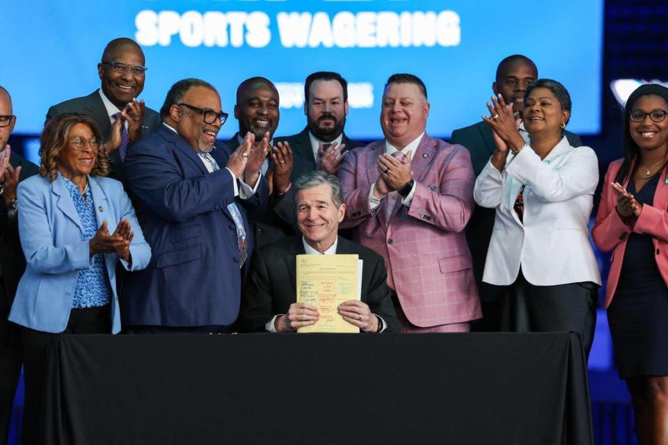 Gov. Roy Cooper signs House Bill 347: Sports Wagering/Horse Racing Wagering into law on Wednesday, June 14, 2023 at Spectrum Center.