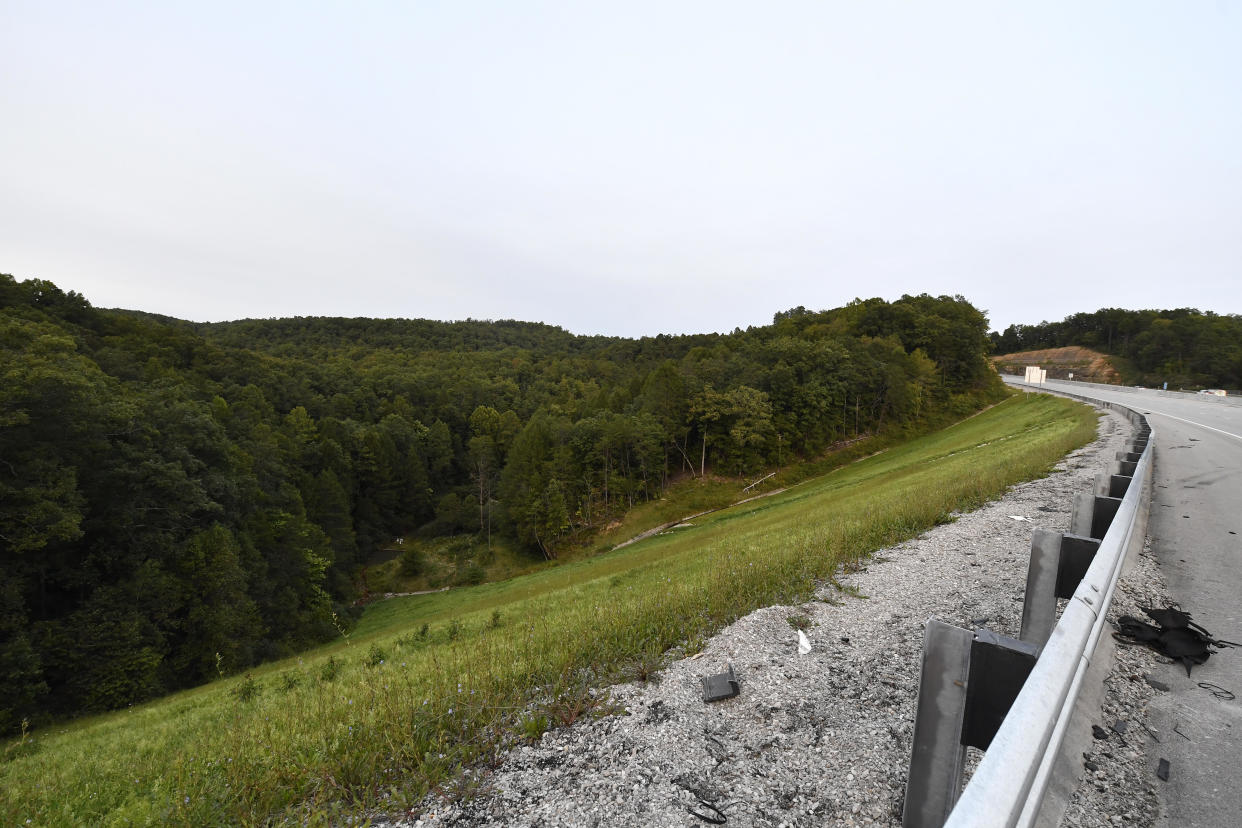 Trees stand in wooded areas alongside Interstate 75 near Livingston, Kentucky, on Sept. 8, 2024, as police search for a suspect in a Sept. 7 shooting along the Interstate. / Credit: Timothy D. Easley / AP