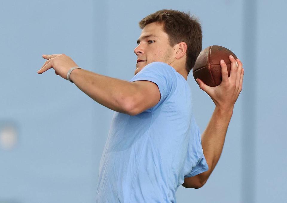 Drake Maye drops back to pass to a receiver during the Carolina Football Pro Day at UNC Chapel Hill’s Koman Indoor Practice Facility on Thursday, March 28, 2024.