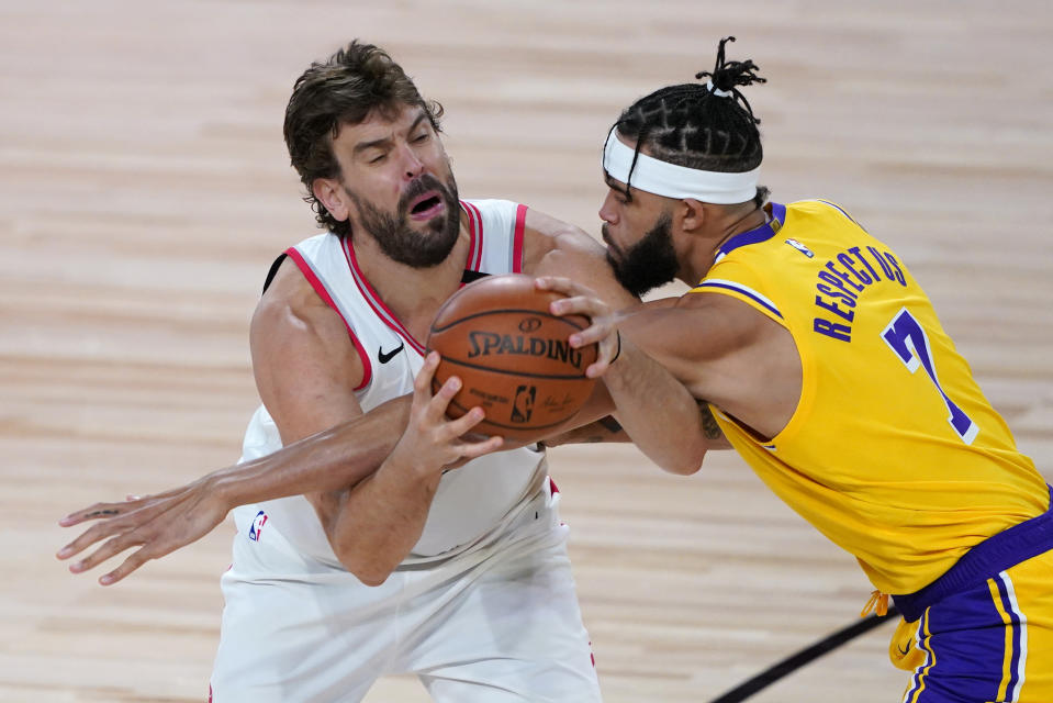 Los Angeles Lakers' JaVale McGee (7) guards Toronto Raptors' Marc Gasol during the second half of an NBA basketball game Saturday, Aug. 1, 2020, in Lake Buena Vista, Fla. (AP Photo/Ashley Landis, Pool)