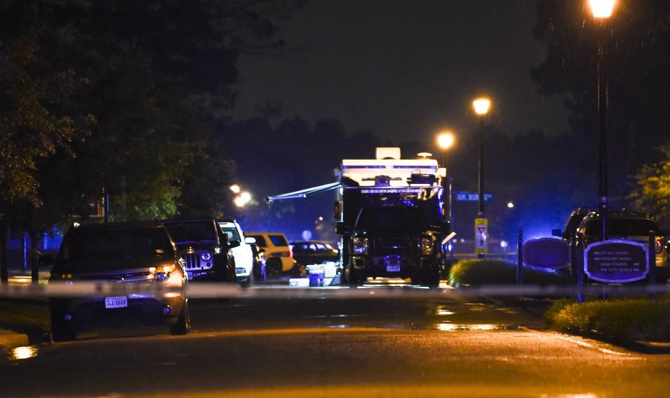 A police command post truck is seen in the distance while a police tape blocks access to the Virginia Beach municipal center, the site of a mass shooting, in Virginia Beach, Virginia in the late hours of May 31, 2019. - A municipal employee sprayed gunfire "indiscriminately" in a government building complex on Friday in the US state of Virginia, police said, killing 12 people and wounding four in the latest mass shooting to rock the country. (Photo by Eric BARADAT / AFP)        (Photo credit should read ERIC BARADAT/AFP/Getty Images)