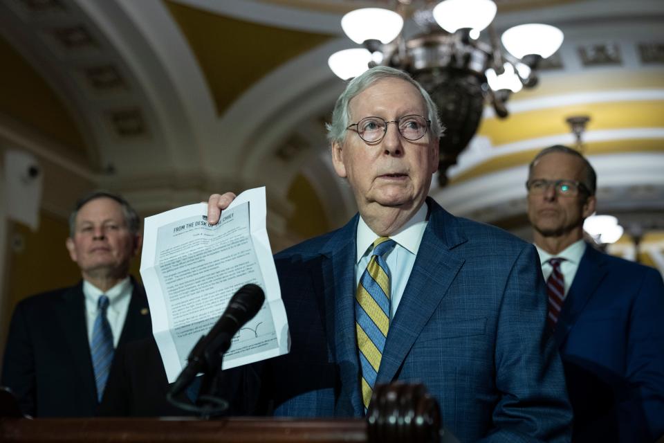 Senate Minority Leader Mitch McConnell, R-Ky., holds up a letter from the U.S. Capitol Police as he denounces Fox News' Tucker Carlson's recent coverage of the January 6, 2021 attack on the Capitol, during a news conference at the U.S. Capitol on March 7, 2023 in Washington, D.C.