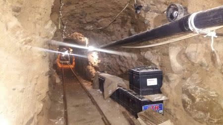 Batteries are stacked next to rails inside a tunnel in this undated photograph provided by Mexico's Federal Police, October 22, 2015. REUTERS/Mexico's Federal Police/Handout
