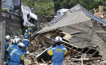 <p>Rescuers prepare to start a search mission for missing person at the site of a landslide in Kumano town, Hiroshima prefecture, western Japan, July 9, 2018. (Photo: Sadayuki Goto/Kyodo News via AP) </p>