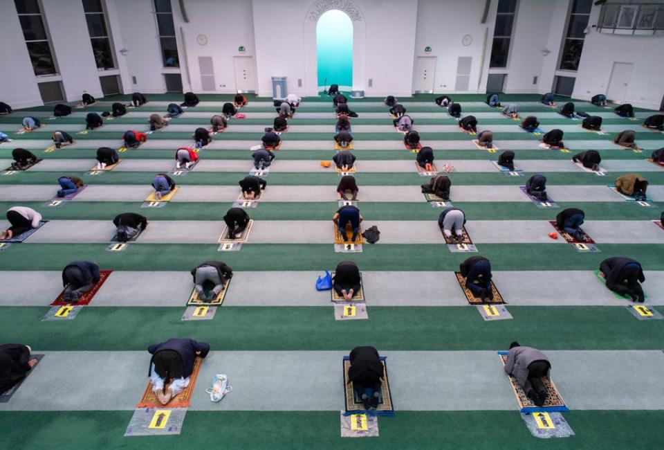 Worshippers observing social distancing at the Baitul Futuh Mosque before the start of Eid al-Fitr celebrations last year (Dominic Lipinski/PA) (PA Wire)