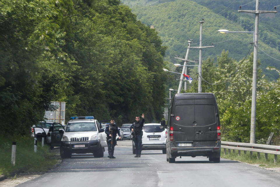 Kosovo police special unit members stop vehicles near the village of Cabra, north western Kosovo, during an ongoing police operation on Tuesday, May 28, 2019. A Kosovo police operation against organized crime in the north, where most of the ethnic Serb minority lives, has sparked tension, and Serbia ordered its troops to full alert. (AP Photo/Visar Kryeziu)