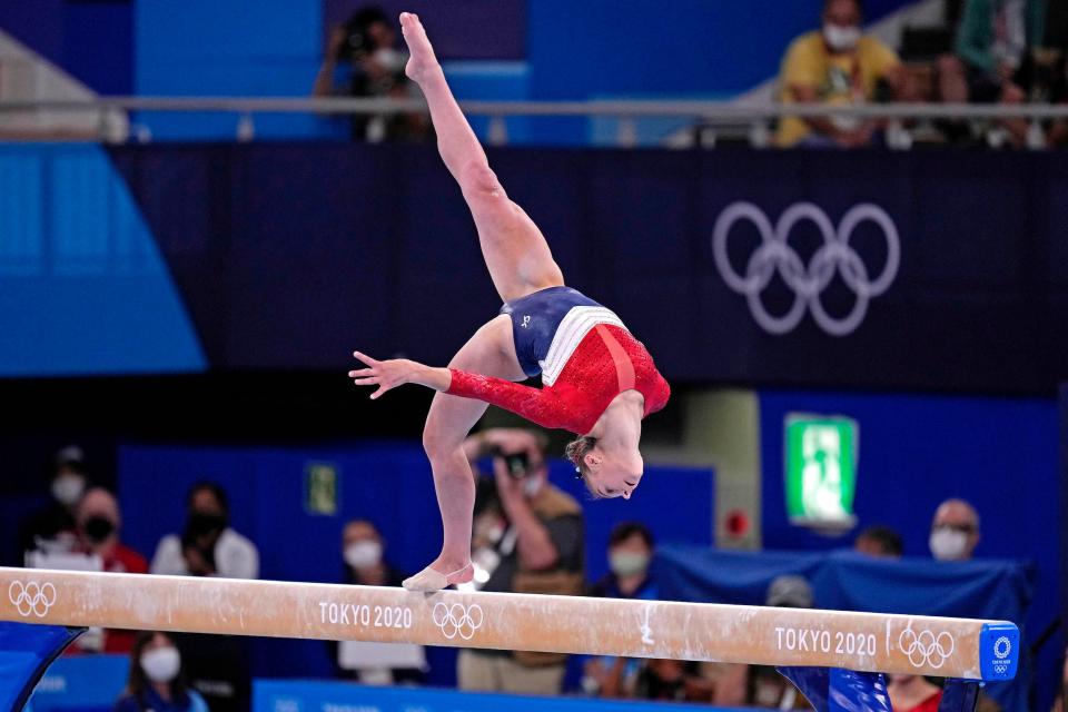 Grace McCallum performs on the balance beam.