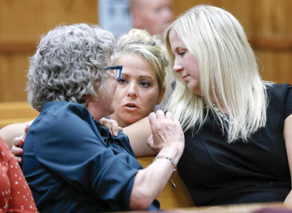 Unidentified women talk to Laura Calderwood, left, Mollie Tibbetts' mother, during a hearing for Cristhian Bahena Rivera at the Poweshiek County Courthouse in Montezuma, Iowa, on Thursday, July 15, 2021. Bahena Rivera was convicted of killing University of Iowa student Mollie Tibbetts in 2018. A judge delayed Bahena Rivera's sentencing after defense attorneys asserted authorities withheld information about investigations into a nearby sex trafficking ring the lawyers say could have been involved in the fatal stabbing. (Jim Slosiarek/The Gazette, Pool)