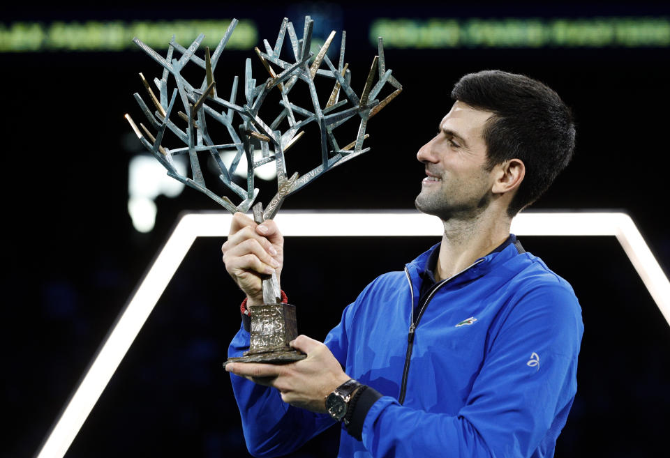 Novak Djokovic of Serbia lifts the trophy after winning the final match of the Paris Masters tennis tournament in Paris, Sunday, Nov. 3, 2019. Djokovic defeated Denis Shapovalov of Canada 6-3/6-4. (AP Photo/Kamil Zihnioglu)