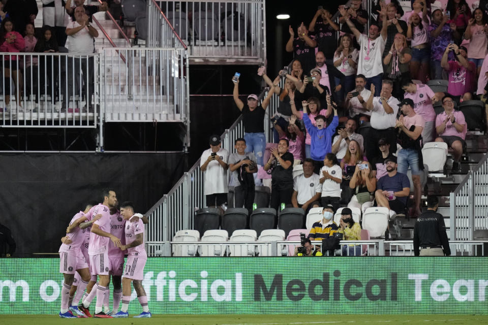 Inter Miami players and fans celebrate a goal by forward Nicolas Stefanelli, obscured, during the first half of an MLS soccer match against Charlotte FC, Wednesday, Oct. 18, 2023, in Fort Lauderdale, Fla. (AP Photo/Rebecca Blackwell)