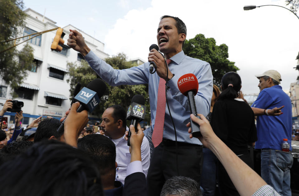 National Assembly President Juan Guaido, who declared himself interim president of Venezuela, speaks to supporters as he visits different points of anti-government protest in Caracas, Venezuela, Tuesday, March 12, 2019. Guaido has declared himself interim president and demands new elections, arguing that President Nicolas Maduro's re-election last year was invalid. (AP Photo/Ariana Cubillos)