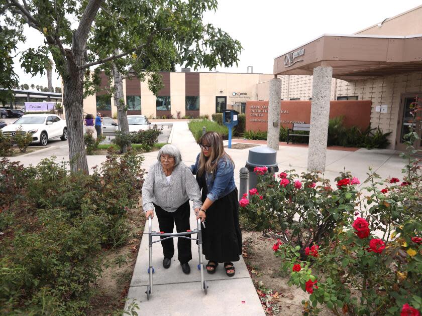 Mariella Rojas picks up her mother, Rosa Angelica Saldana, from OneGeneration Adult Day Care