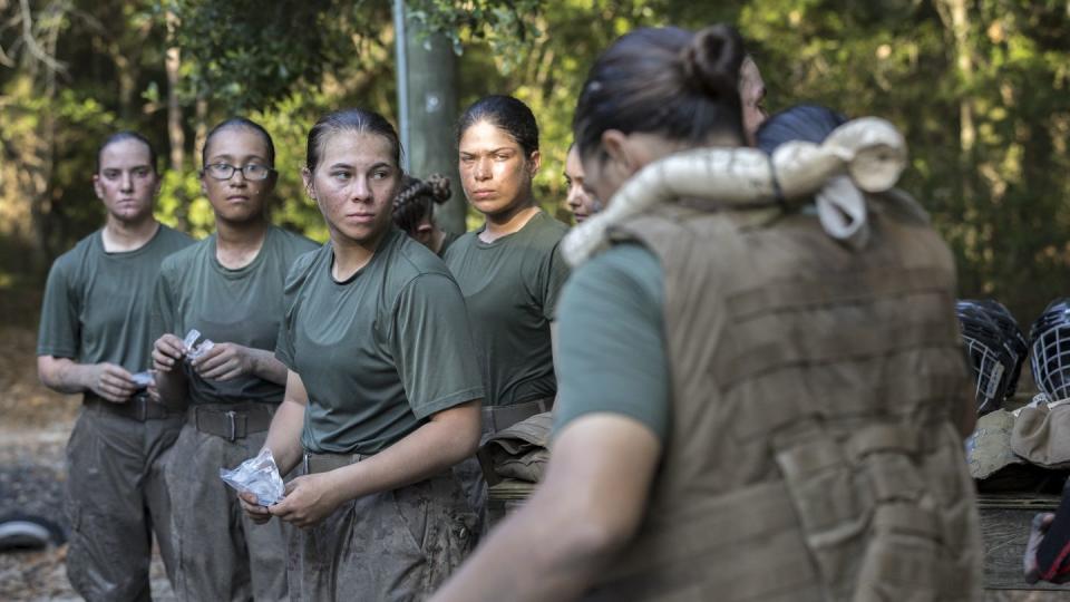 Members of a platoon of female U.S. Marine Corps recruits gear up before training in hand-to-hand combat at the Marine Corps Recruit Depot, Thursday, June 29, 2023, in Parris Island, S.C. (Stephen B. Morton/AP)