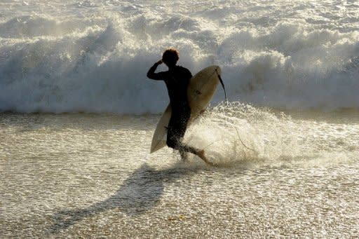 This file illustration photo shows a surfer at Injidup Beach, in the south-west corner of Western Australia. A surfer was apparently bitten to death by a shark off Australia's west coast on Saturday, police said, the fifth such fatal attack in the region in less than a year