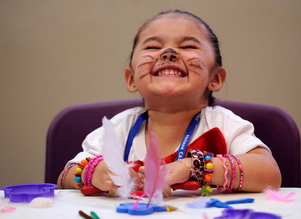 Then 3-year-old Natalie Dominguez laughs while making Dr. Seuss characters out of clay on June 15, 2012, at the National Center for Children's Illustrated Literature during the first Children's Art & Literacy Festival.