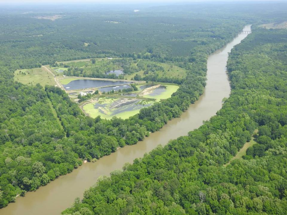 Aging waste ponds lie along the banks of the Broad River near Carlisle Finishing in Union County, about 60 miles upriver from Columbia’s canal drinking water plant. Forever chemicals, a class of toxic compounds, have been found in the river.