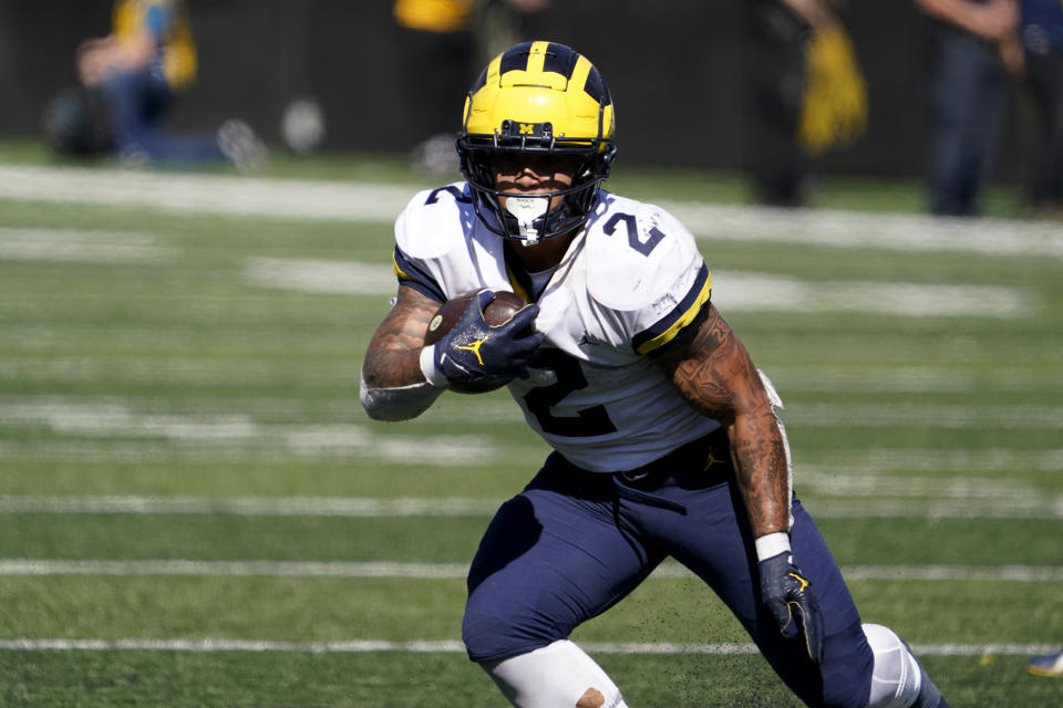 Michigan running back Blake Corum carries the ball up field during a 20-yard touchdown run in the second half of an NCAA college football game against Iowa, Saturday, Oct. 1, 2022, in Iowa City, Iowa. Michigan won 27-14. (AP Photo/Charlie Neibergall)