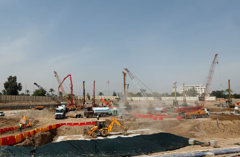 FILE PHOTO: Construction workers build the Rixos Baghdad, in Baghdad's Green Zone