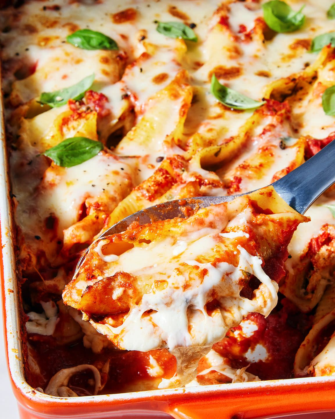 stuffed shells with marinara sauce mozzarella ricotta cream cheese and pecorino