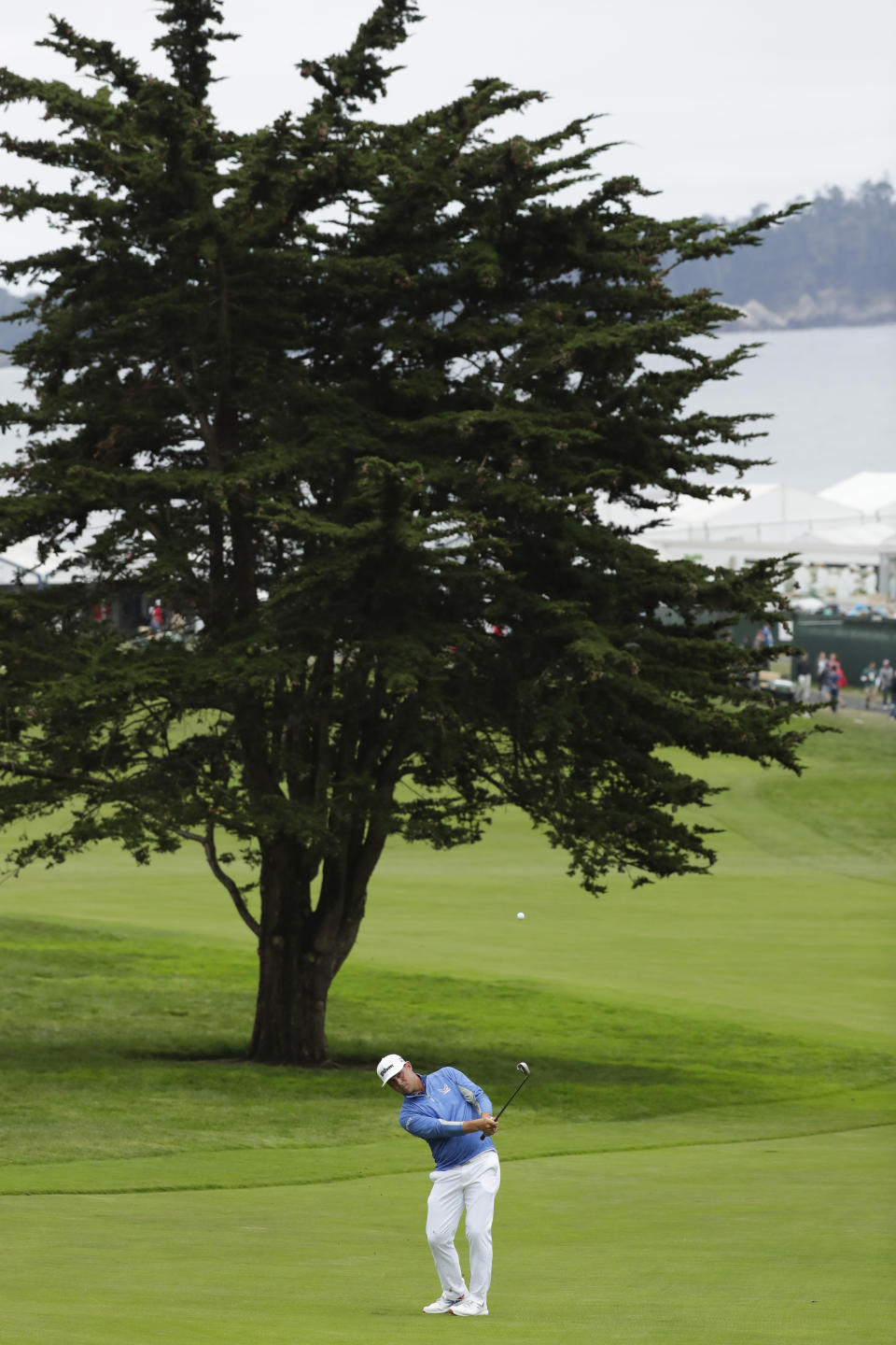 Gary Woodland hits from the fairway on the 14th hole during the third round of the U.S. Open golf tournament Saturday, June 15, 2019, in Pebble Beach, Calif. (AP Photo/Matt York)