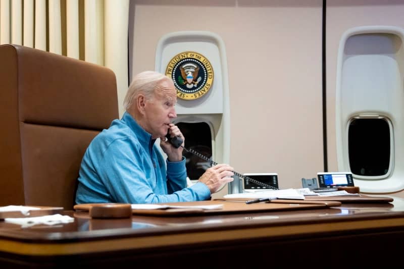 US President Joe Biden holding a call with Egyptian President Abdel Fattah El-Sisi from his private office aboard Air Force One on the return to the White House on October 19, 2023. Biden discussed humanitarian assistance and preventing escalation in the Gaza Strip crisis. White House/ZUMA Press Wire/dpa