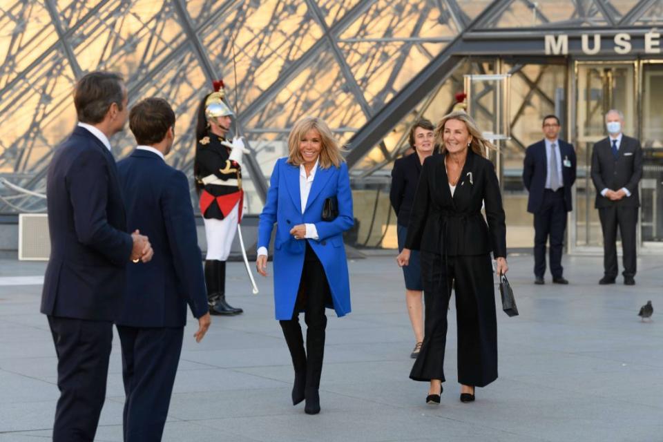 Emmanuel Macron, Kyriakos Mitsotakis, Brigitte Macron and Mareva Grabowski Mitsotakis. French President Emmanuel Macron and the Prime Minister of Greek Kyriakos Mitsotakis visiting the exhibition Paris-Athens, Birth of Modern Greece at the Louvre museum, Sept. 27. - Credit: AP